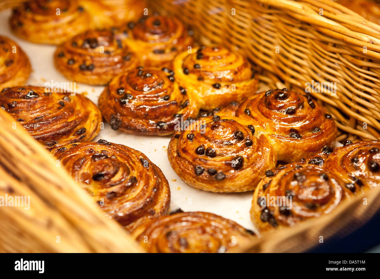 Buns with raisins in the basket Stock Photo