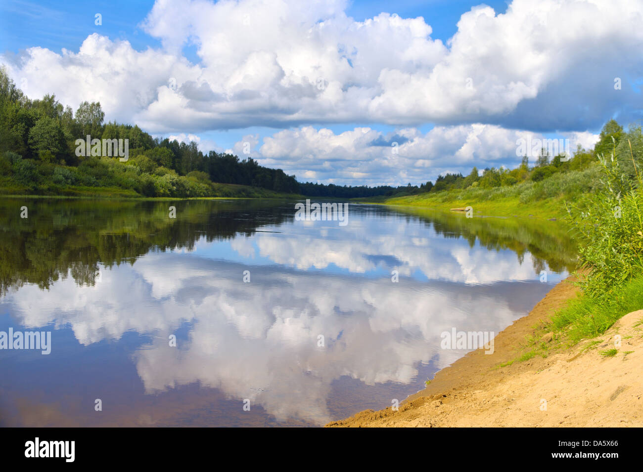 River Landscape with blue Sky and Clouds mirror reflection in water and ...