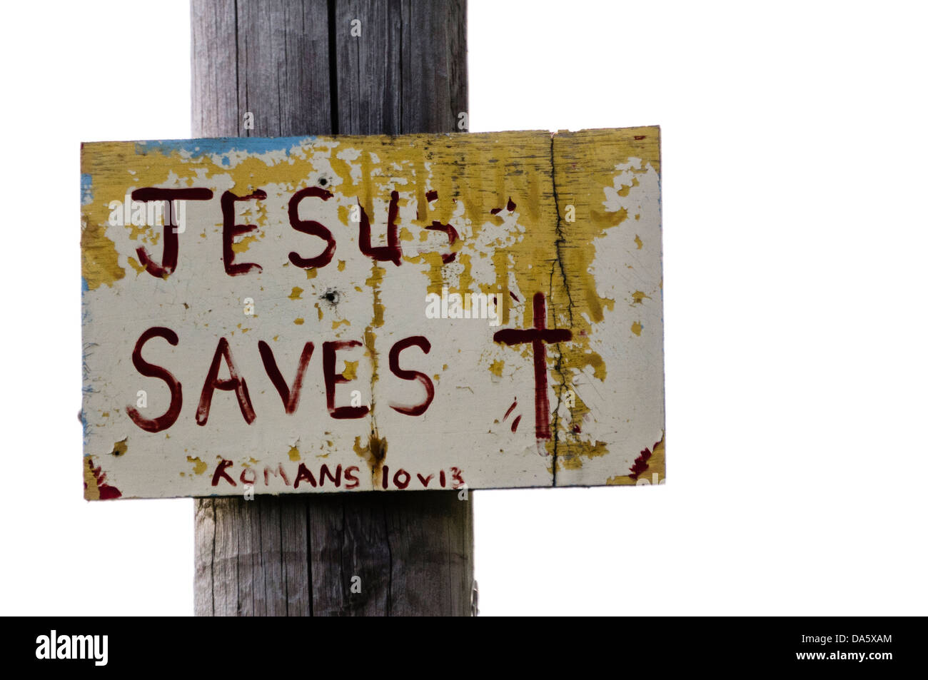 Sign on a lampost with hand-written message 'Jesus Saves', typical of many signs found in rural parts of Northern Ireland Stock Photo