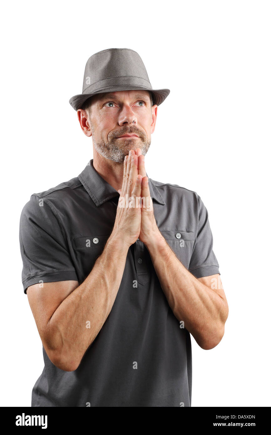 Portrait of a 40-something male wearing a fedora and looking up with hands on chin, isolated on white. Stock Photo