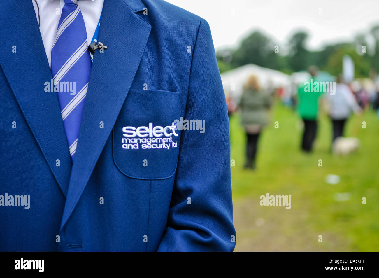 Security guard wears a formal uniform for Select Security, a provider of security and event staff in Northern Ireland. Stock Photo