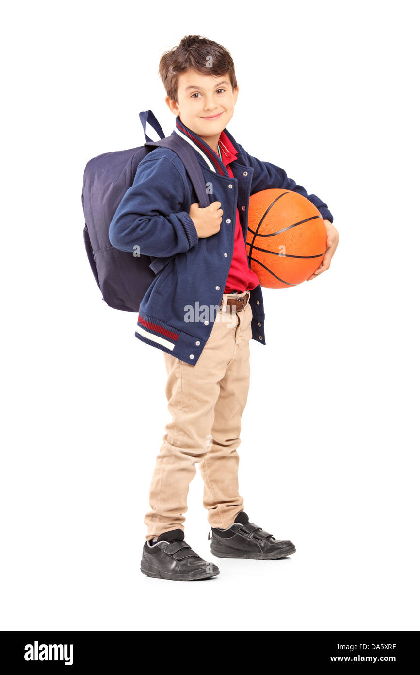 Full length portrait of a schoolboy with backpack holding a basketball ...