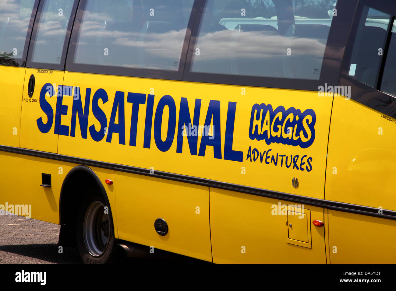 Sensational Haggis adventures yellow tour bus Stock Photo