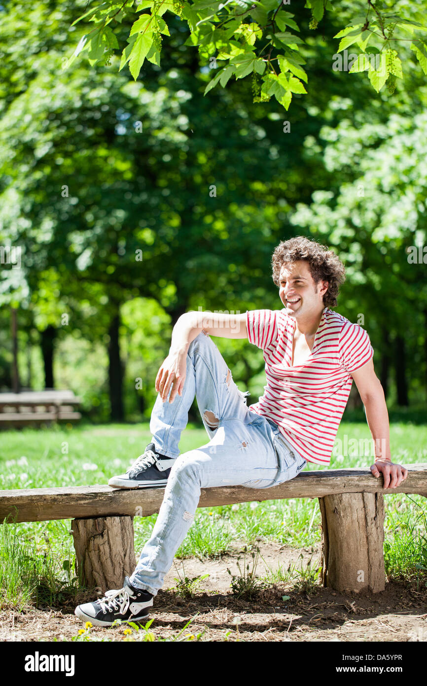 A young handsome man enjoying himself at the park Stock Photo - Alamy