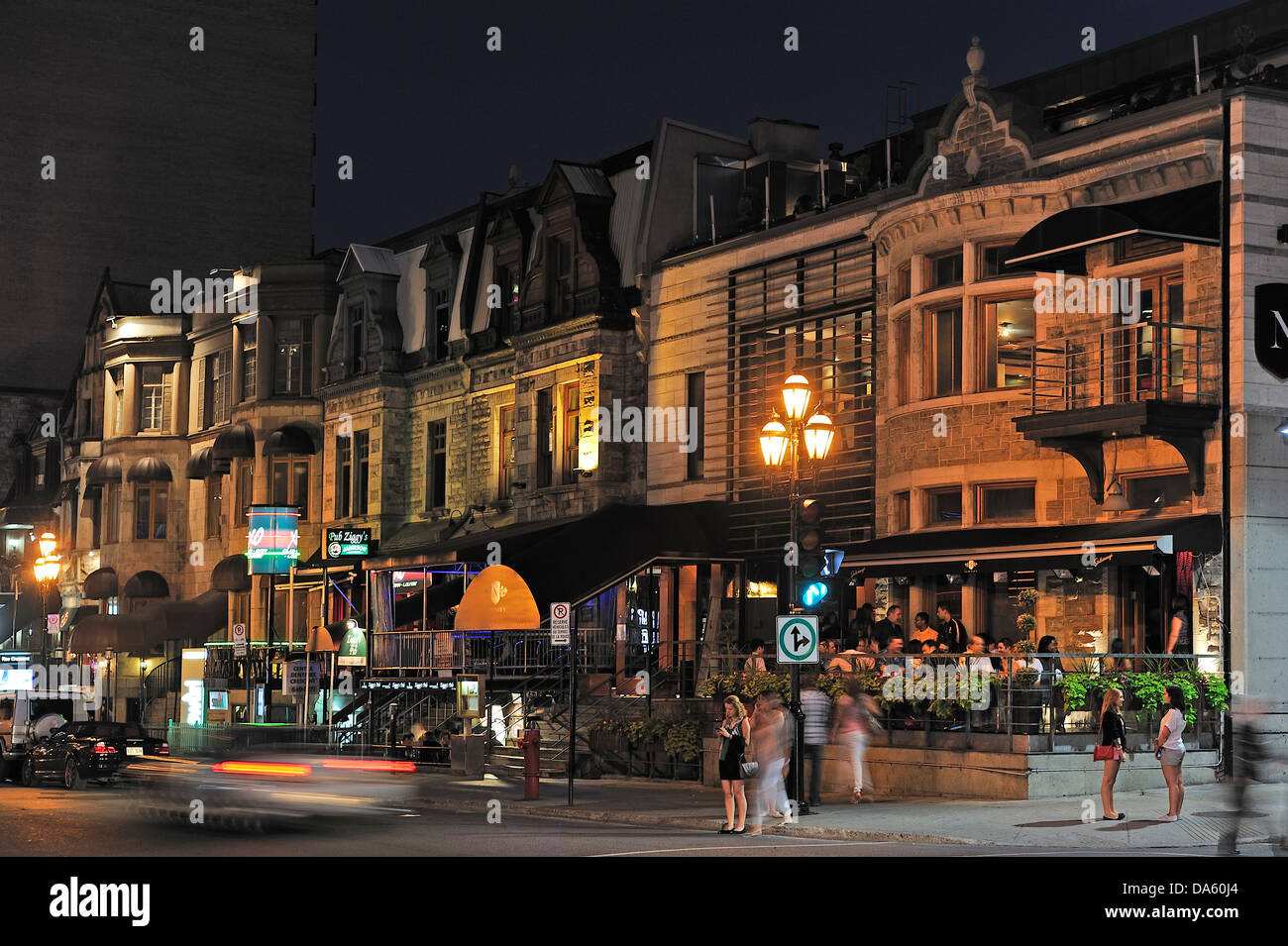 Canada, Montreal, Quartier de Musee, Quebec, buildings, chatting, cross walk, dark, houses, lamp, men, night, pedestrians, resta Stock Photo