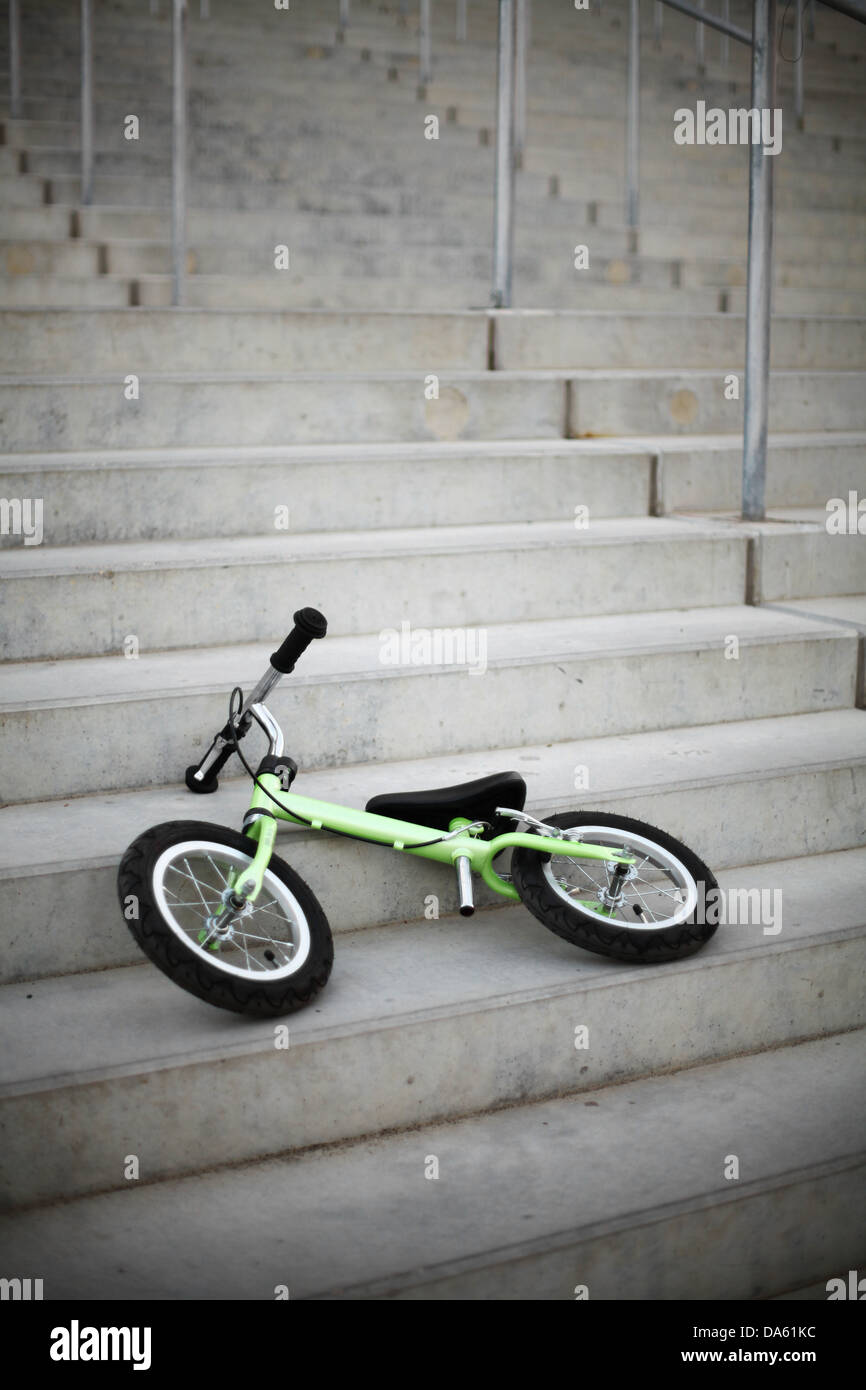 Small bicycle without pedals, on some stairs Stock Photo Alamy