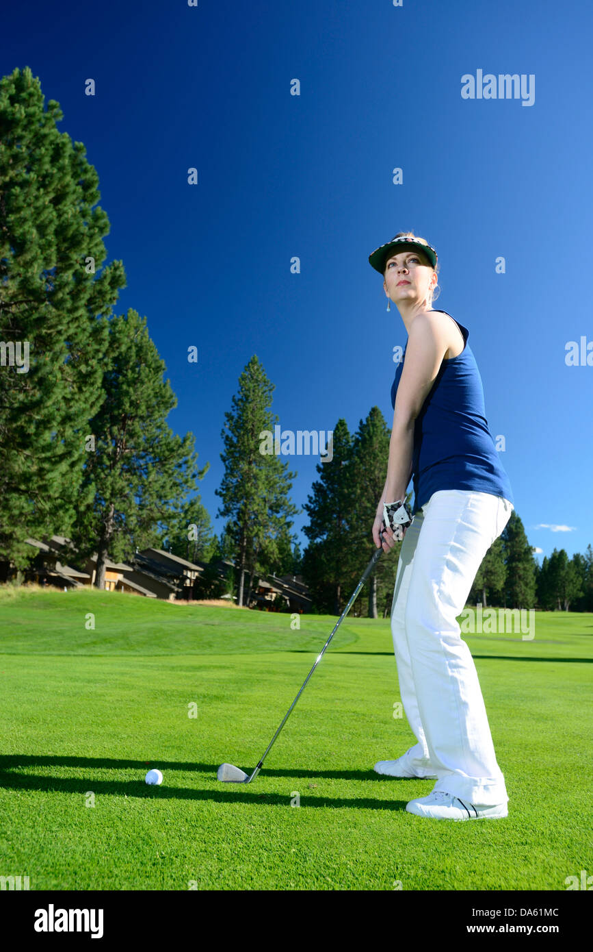 Oregon, USA, United States, America, Pacific Northwest, woman, golf, golfer, white pants, green, lawn, sport, resort, Stock Photo