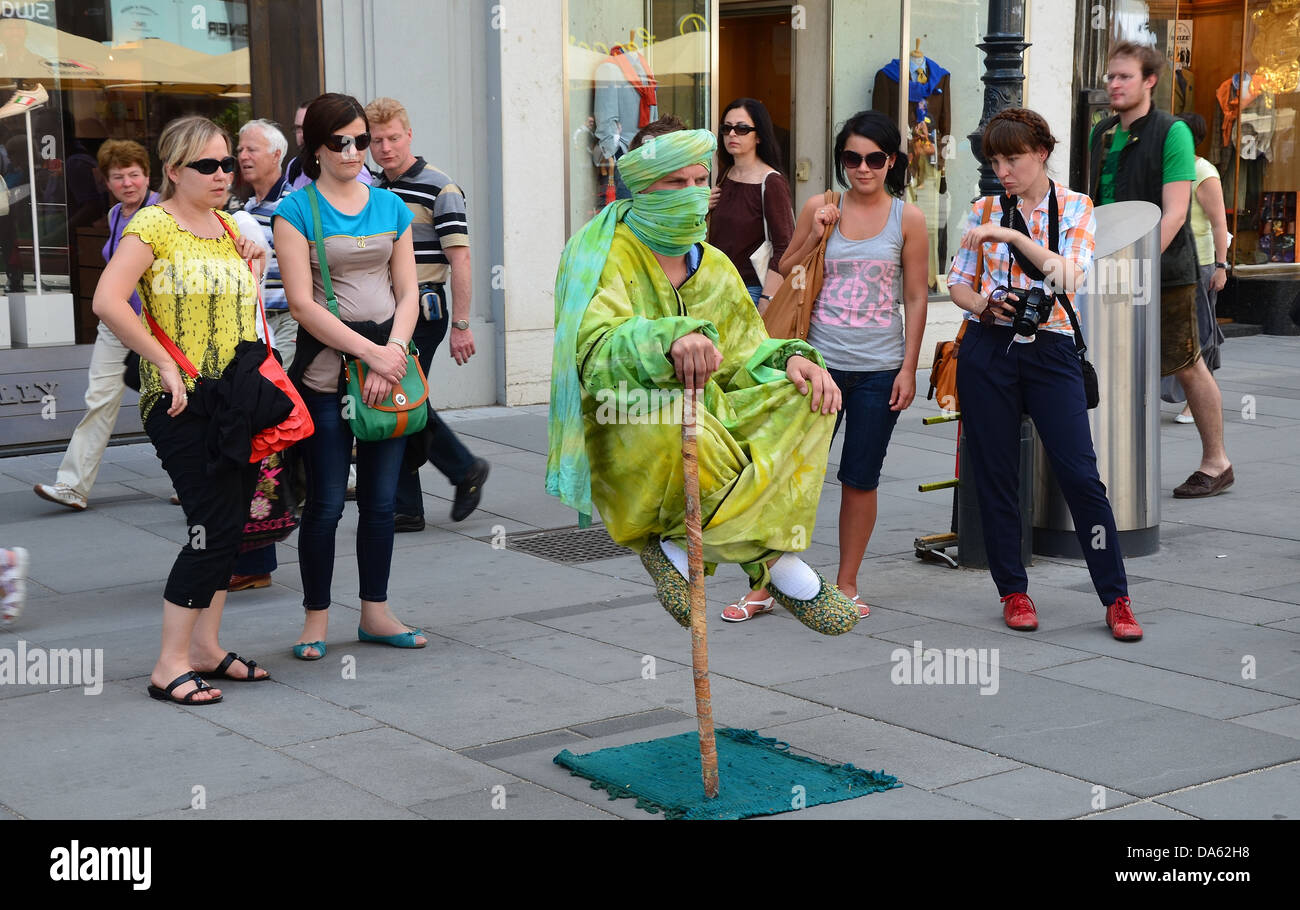 street performer in Vienna, Austria, seems to hover in the air and has been one of the attractions of the pedestrian area. Stock Photo