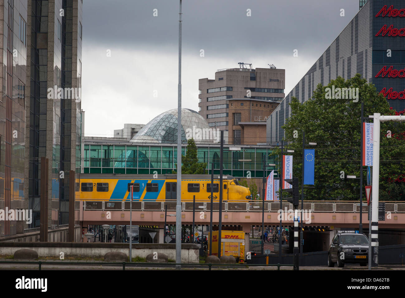Passenger train departing Eindhoven over a viaduct in the city, Netherlands Stock Photo