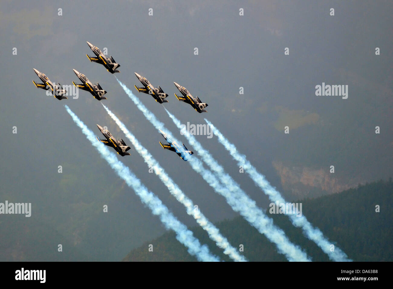 SION, SWITZERLAND, Breitling jet team in close formation trailing smoke at the Breitling Air show.  September 17, 2011 in Sion, Stock Photo