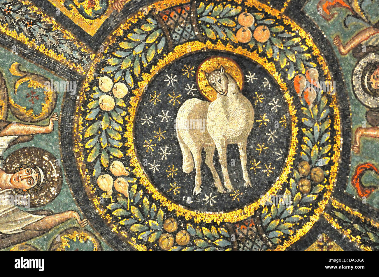 Ancient Byzatine mosaics of the lamb of god in heaven, supported by angels. From the UNESCO listed basilica of Saint Vitalis, in Stock Photo