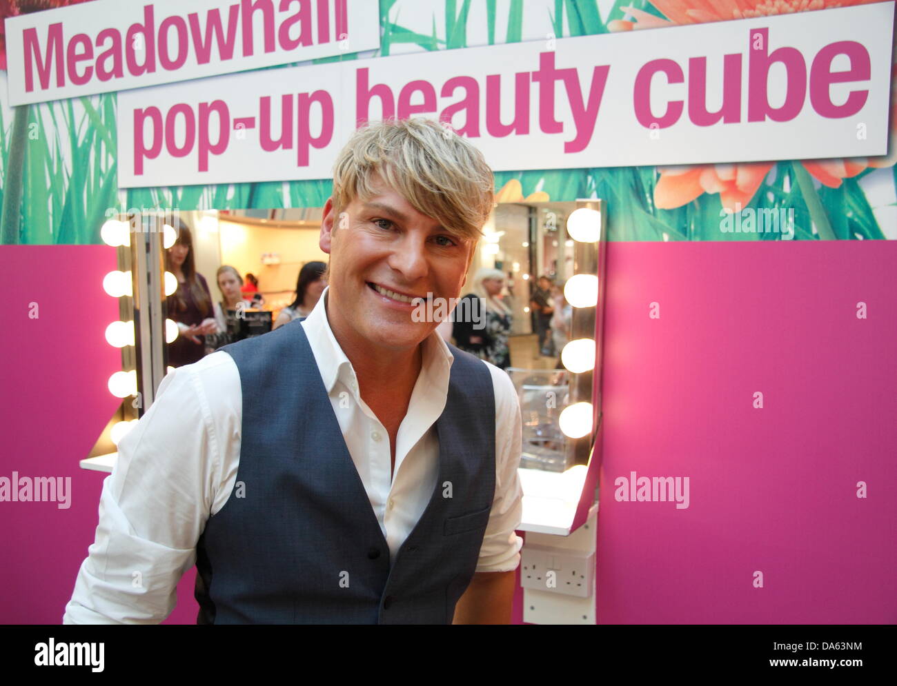 Sheffield, UK. 4th July 2013. Celebrity make up artist, Gary Cockerill presented make-up demonstrations and shared beauty tips at his pop-up beauty cube during the inaugural 'Girls Night In' event, Meadowhall shopping centre. Girls Night In celebrated the Race for Life event held at Meadowhall last month that raised £300,000 for charity, Cancer Research.  Over 6 000 women registered for Girls Night In. The evening featured celebrity events, entertainment, demonstrations, giveaways & offers. Credit:  Deborah Vernon/Alamy Live News Stock Photo