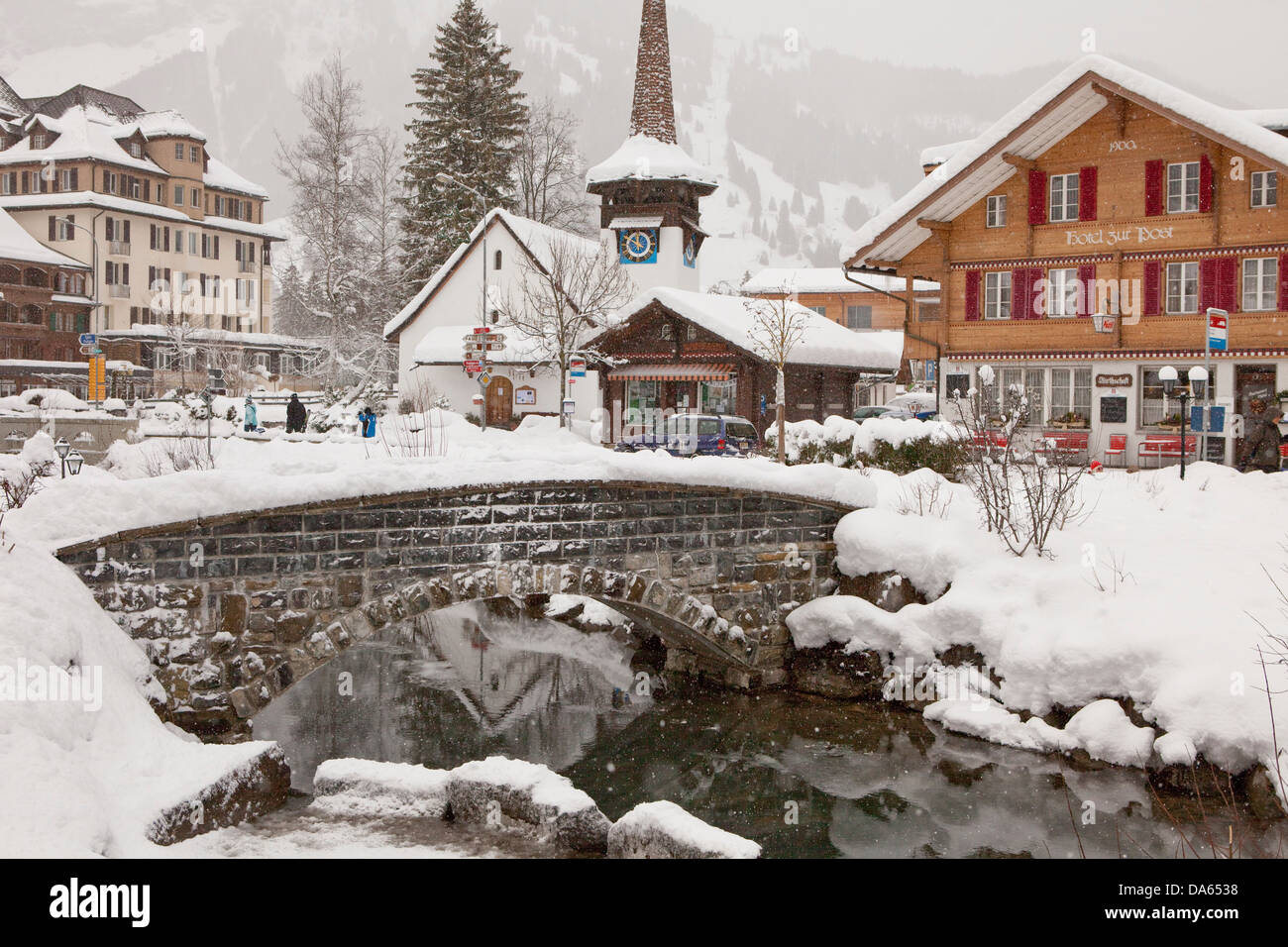 Houses, Homes, Kandersteg, BE, winter, canton, Bern, Bernese Oberland, snow, Switzerland, Europe, bridge, brook, stone bridge Stock Photo