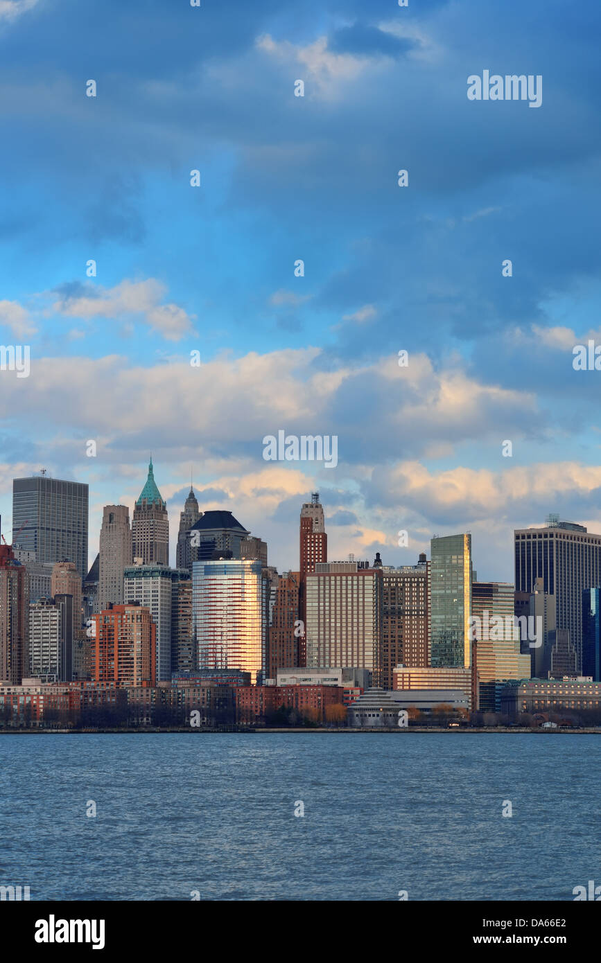 Downtown Manhattan skyline at sunset over Hudson River in New York City ...