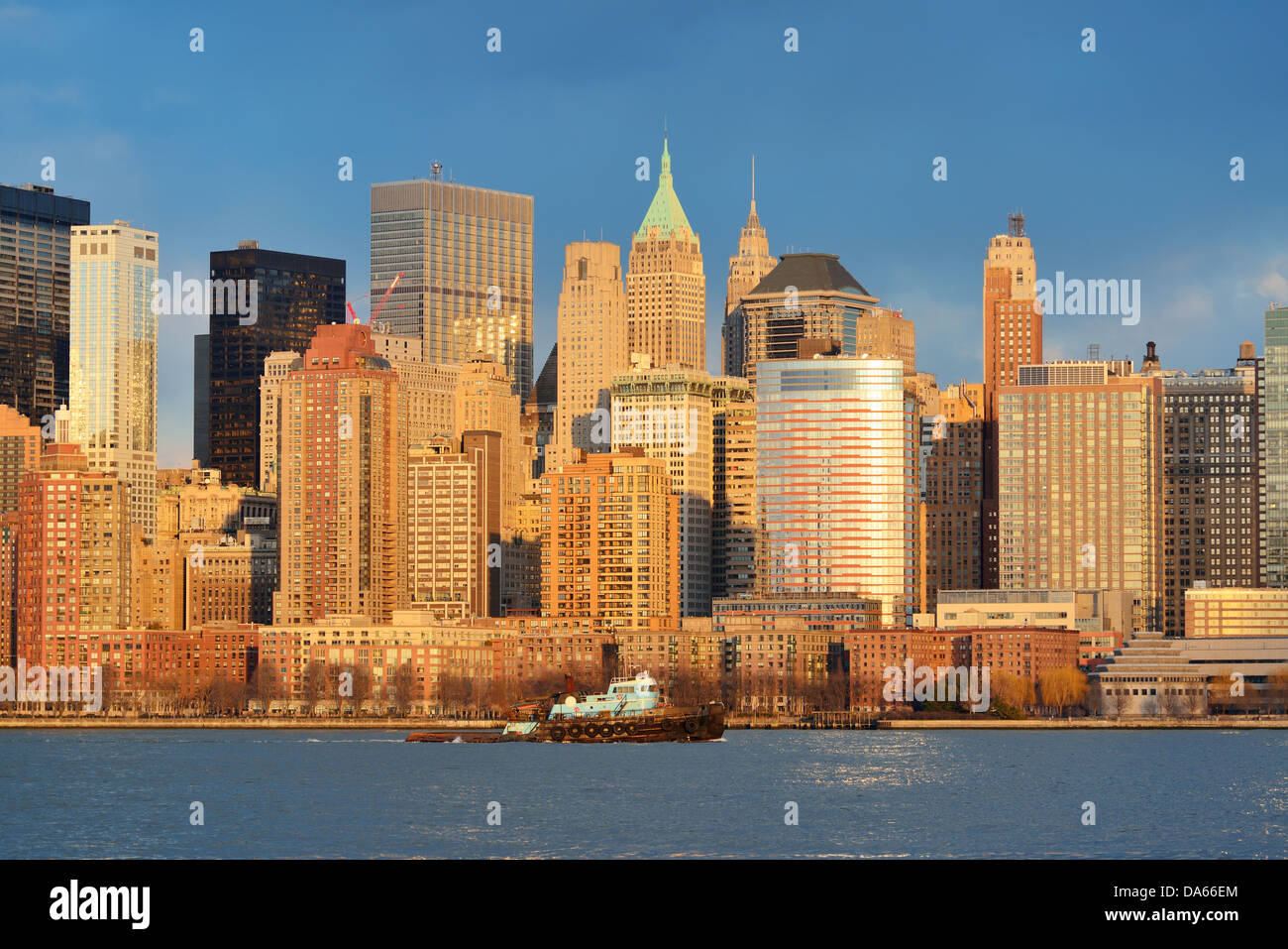 Downtown Manhattan skyline at sunset over Hudson River in New York City ...