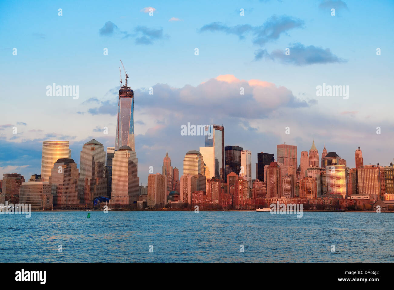 Downtown Manhattan skyline at sunset over Hudson River in New York City ...