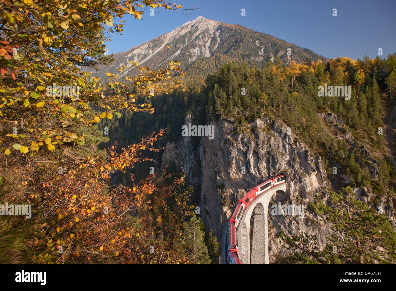 Glacier express, Landwasserviadukt, road, railway, train, railroad, bridge, autumn, wood, forest, canton, GR, Graubünden, Grison Stock Photo