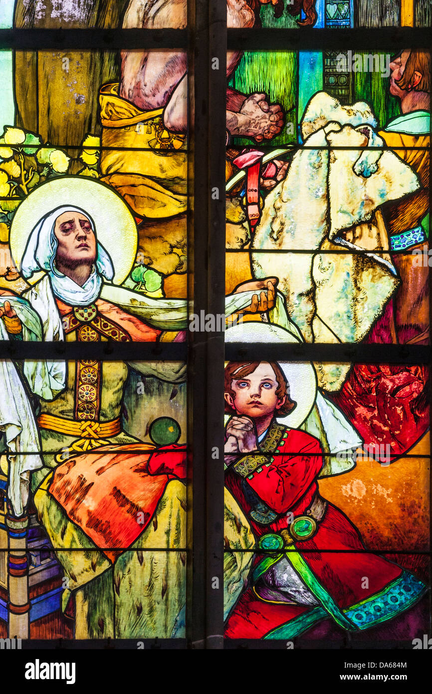 Part of stained glass window by Alphonse Mucha in St Vitus Cathedral, Prague depicts Good King Wenceslas as boy and St.Ludmilla. Stock Photo