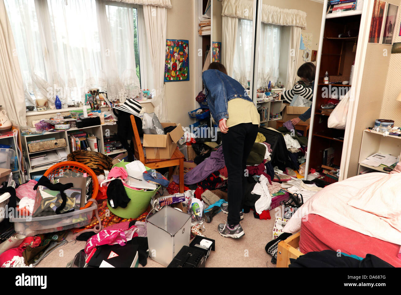 Teenage Girl In Her Messy Bedroom England Stock Photo