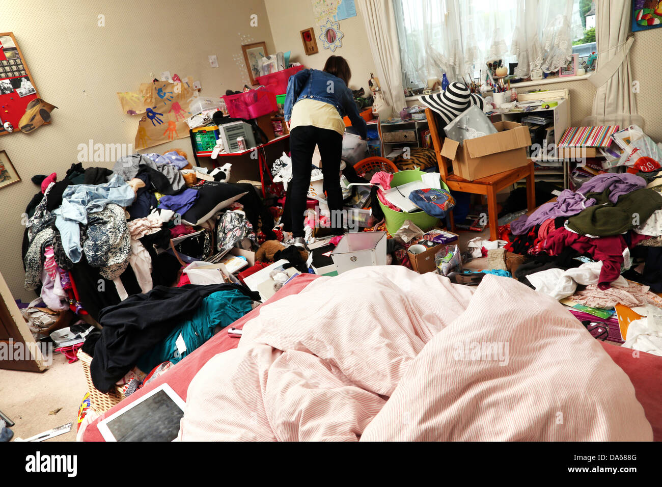 Teenage Girl In Her Messy Bedroom England Stock Photo