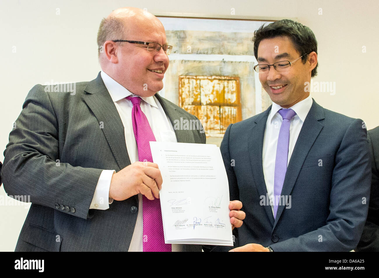 Berlin, Germany. July 5th 2013. Inter alia press conference with German Minister Philipp Rösler and Minister Peter Altmaier about concept of citizen participation in network expansion with agreement signing between the companies and the Government. Credit: Credit:  Gonçalo Silva/Alamy Live News. Stock Photo