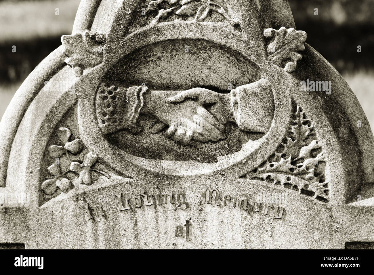 Hands on headstone Stock Photo Alamy