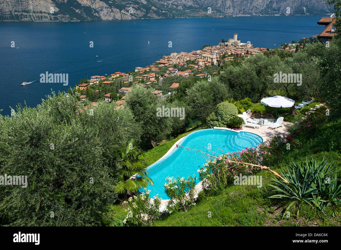 Lake Garda, Italy, Europe, Lago di Garda, Malcesine, town view, hotel pool, pool arrangement, pool, hotel, tourism, Swimming poo Stock Photo