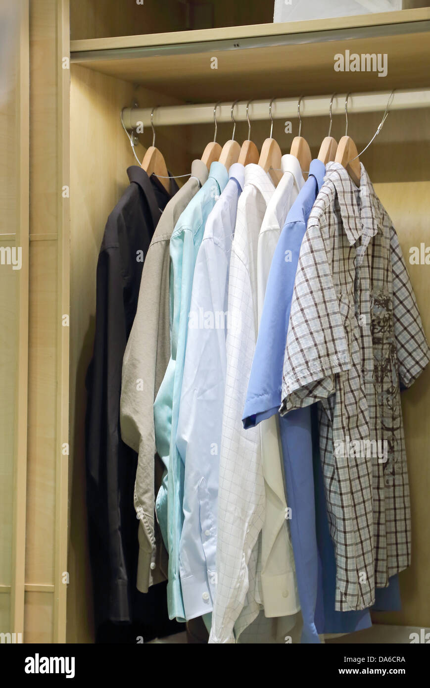 Man clothes hanging in closet Stock Photo Alamy