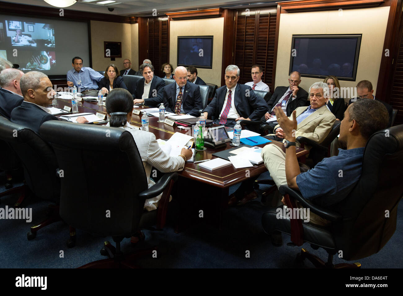 US President Barack Obama meets with members of his national security team to discuss the political crisis in Egypt in the Situation Room of the White House July 4, 2013 in Washington, DC. Stock Photo