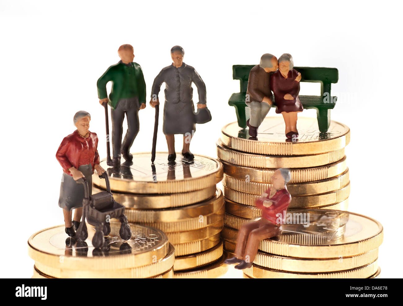 Model figurines on euro coins as a symbol of the retirement pension. Stock Photo