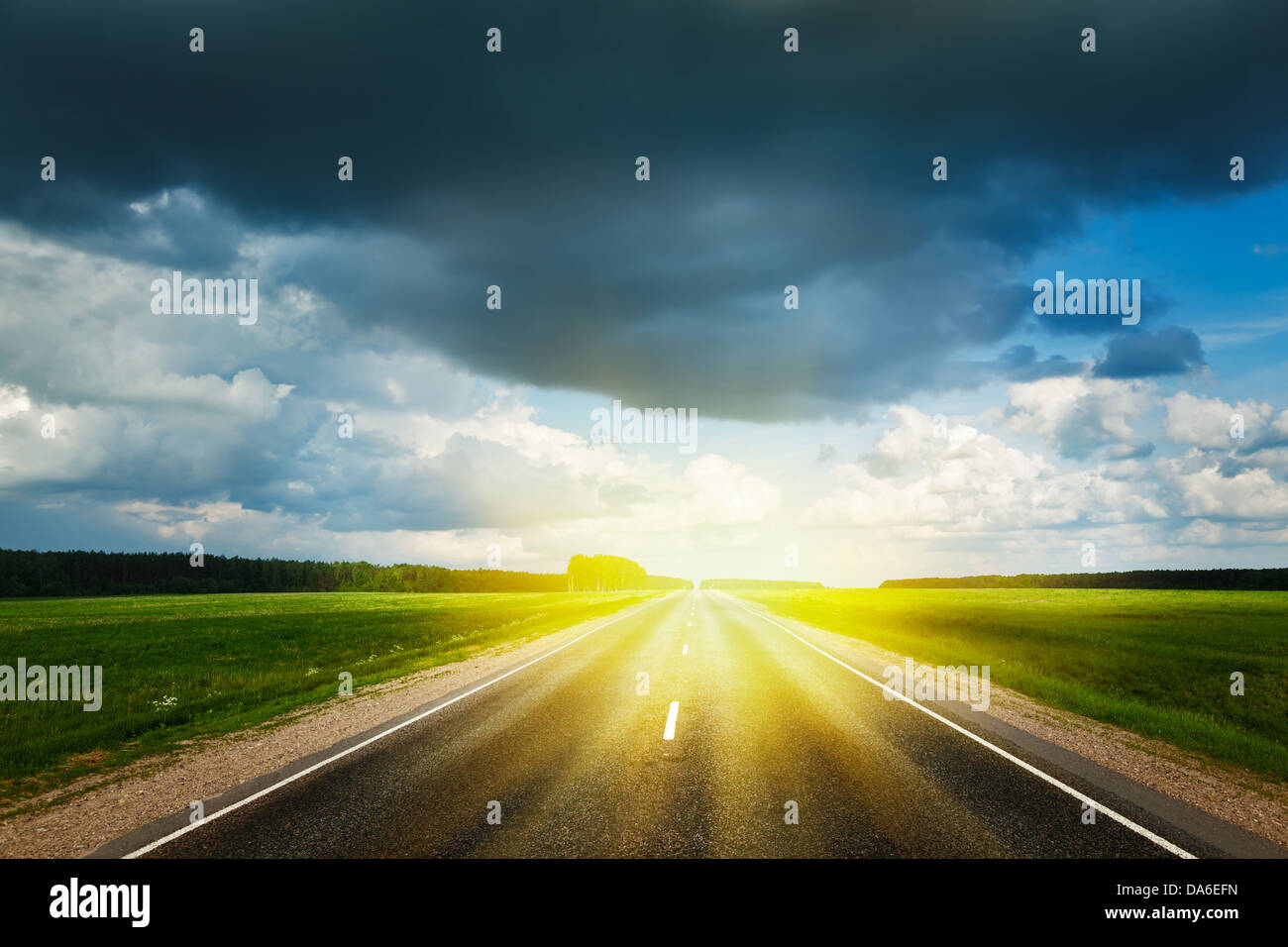 Travel concept background - road and stormy sky Stock Photo - Alamy
