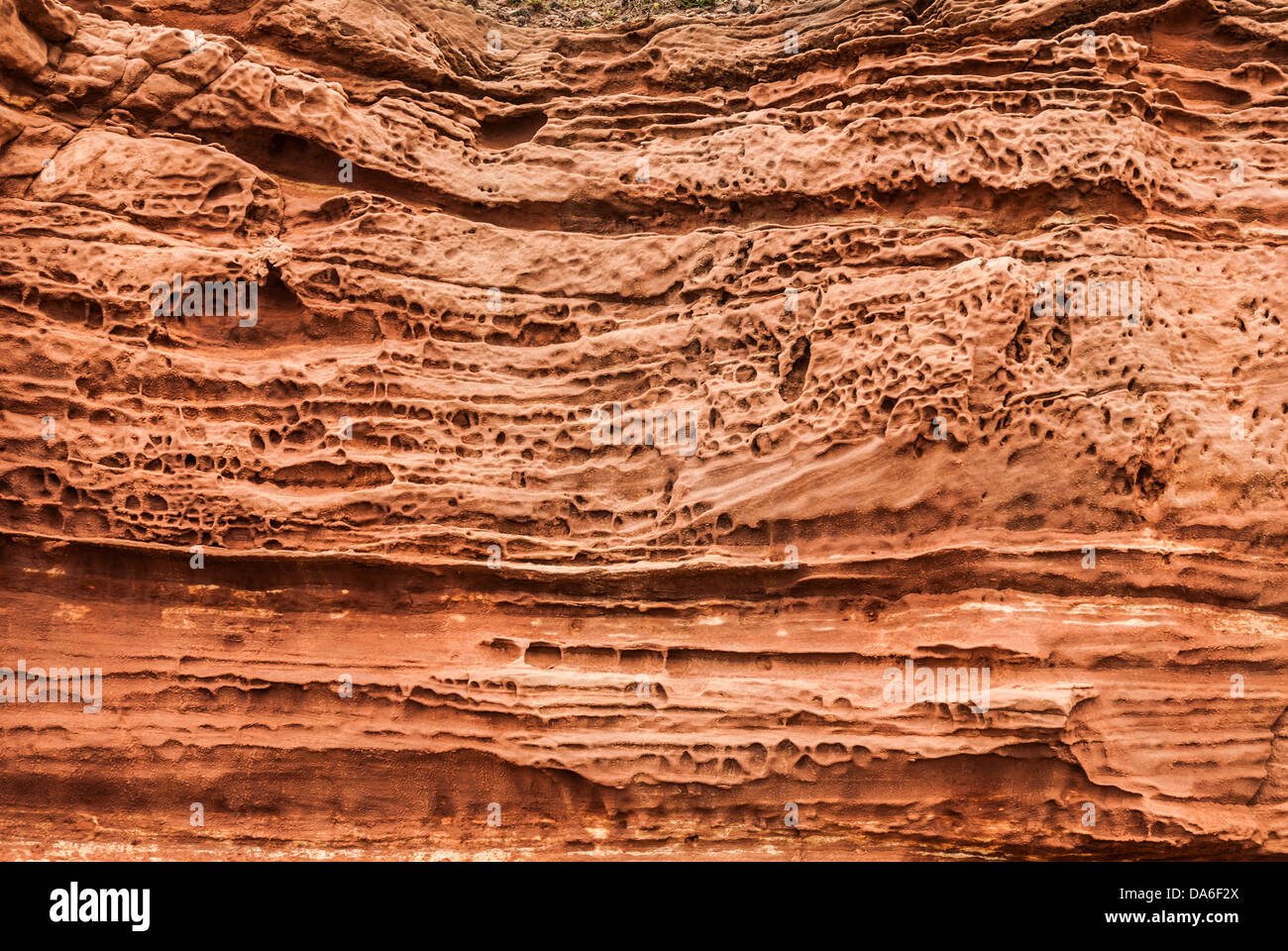Weathered sandstone detail showing eroded layers. Stock Photo