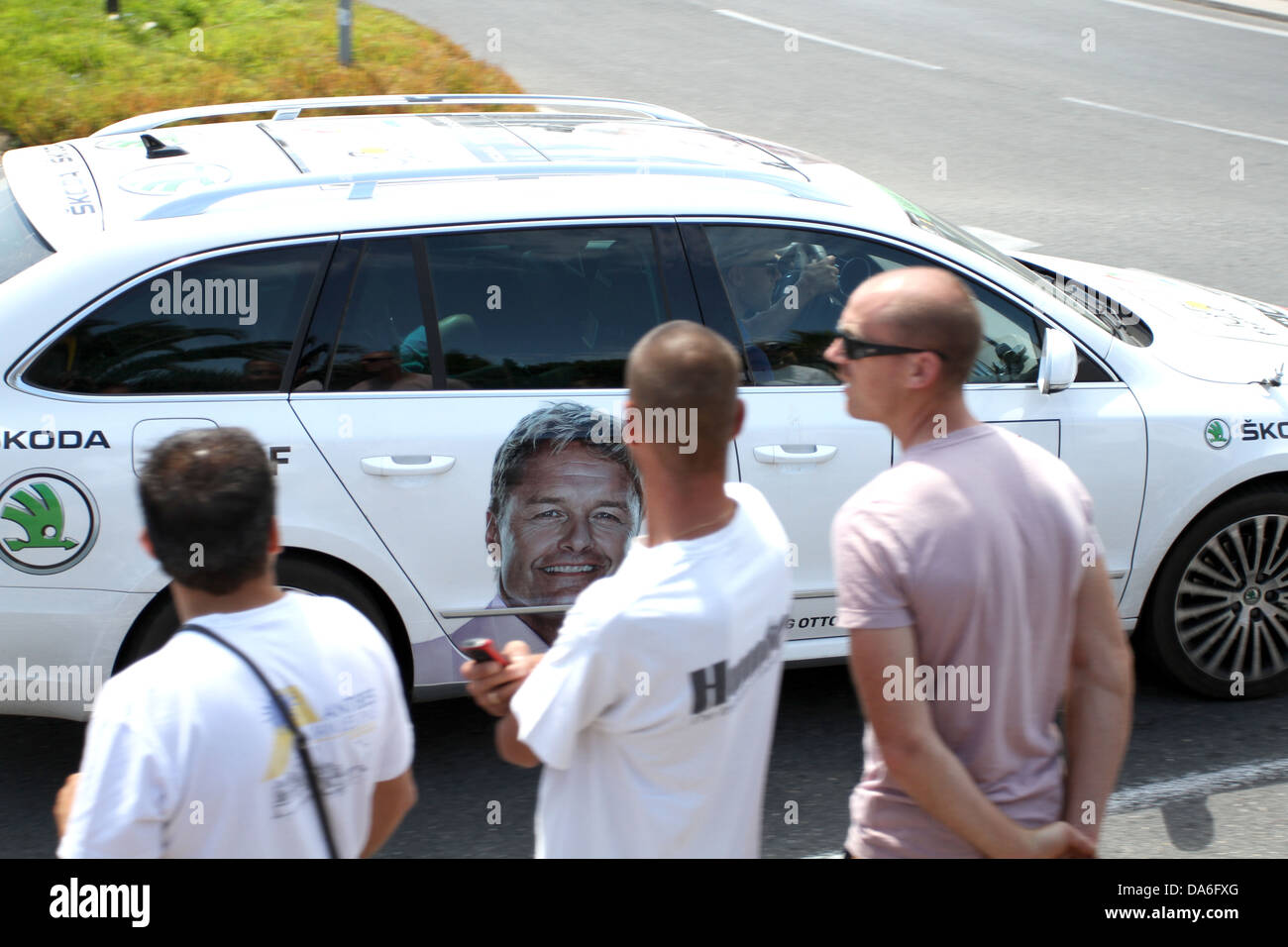 Official car during the Tour de France cycle race in Antibes carrying the portrait of Otto Lauritzen Stock Photo