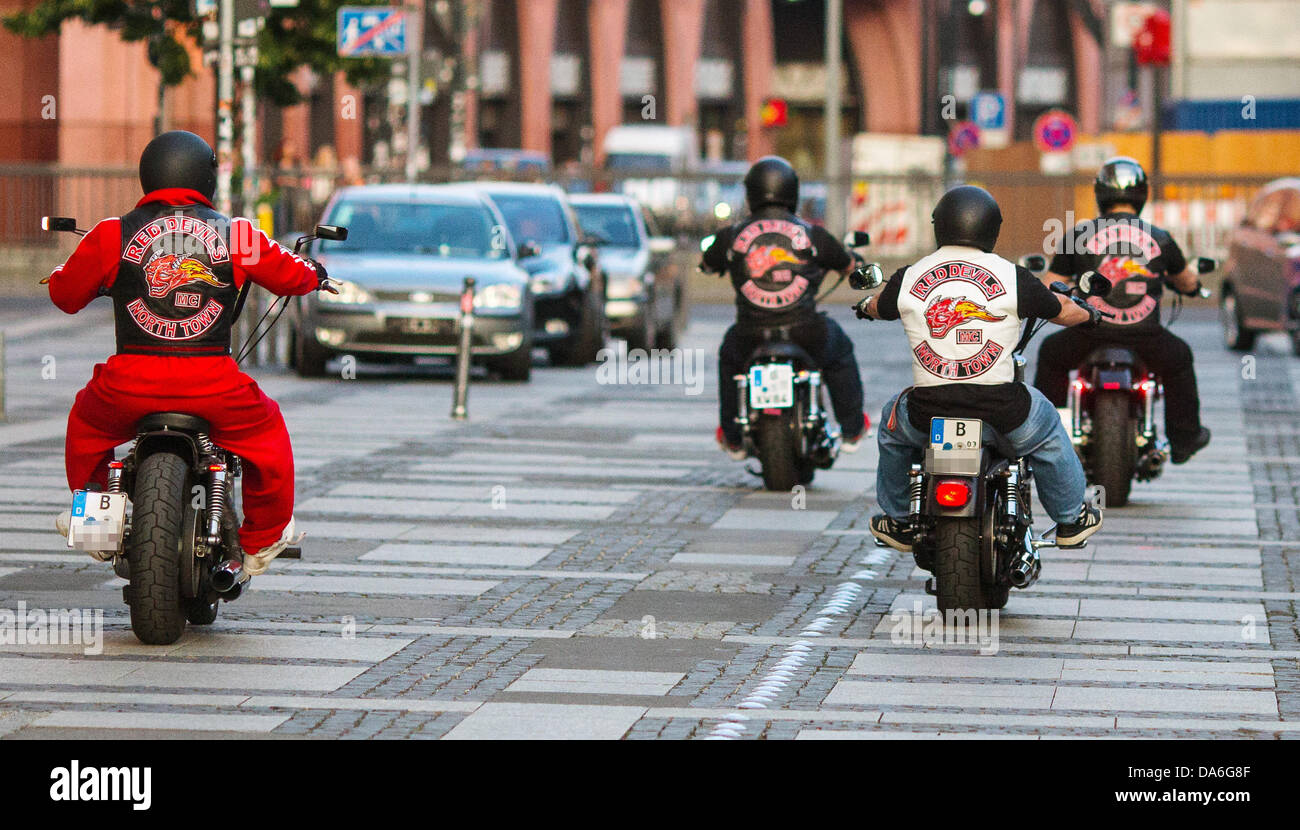 Bikers of biker club 'Red Devils' drive their motorcycles on Alexanderplatz in Berlin, Germany, 02 July 2013. The 'Red Devils' are considered supporters of biker gang 'Hells Angels'. Photo: HANNIBAL/dpa Stock Photo