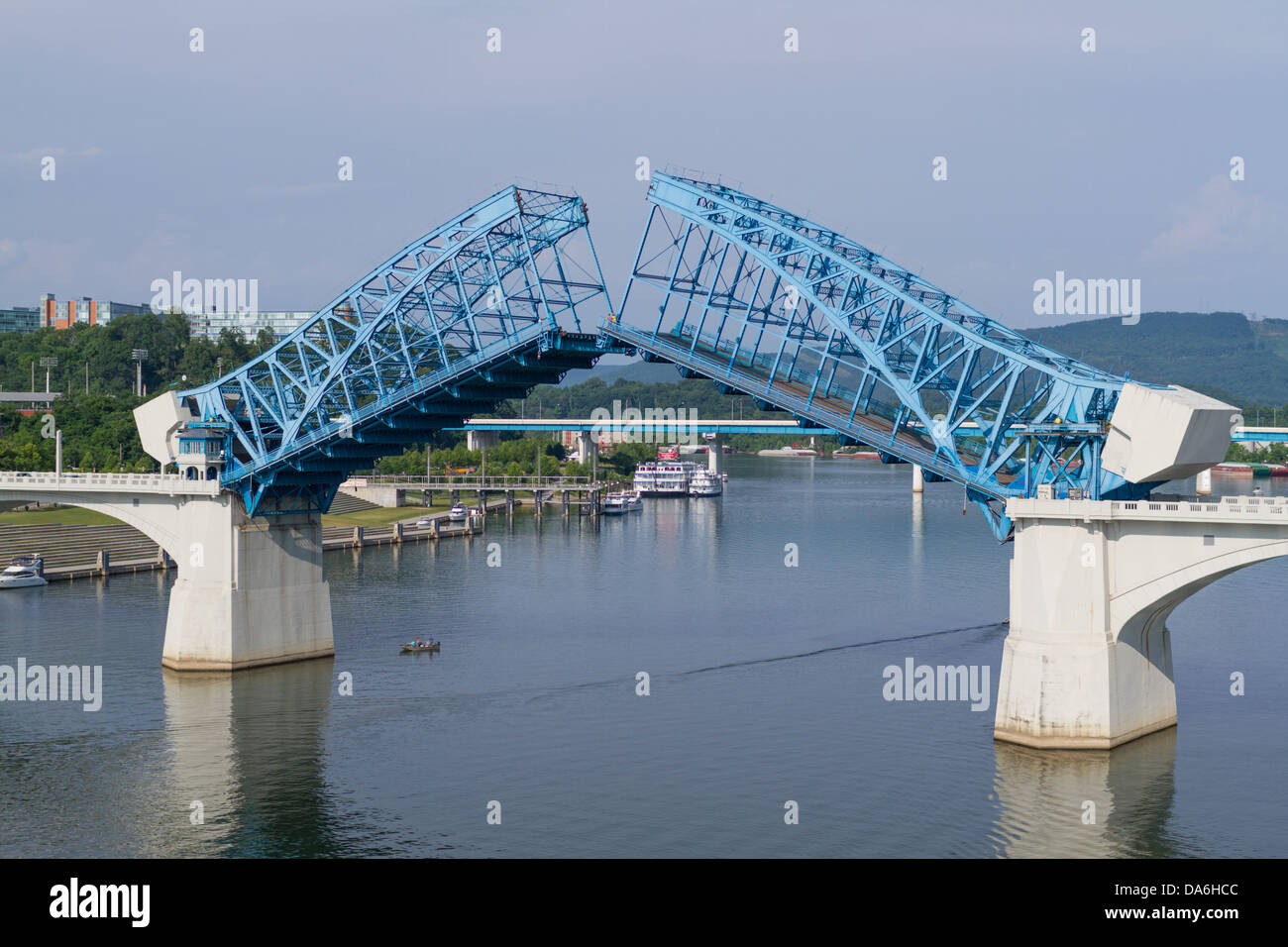 The Market Street drawbridge is up, a small boat passes underneath on the Tennessee River. Stock Photo