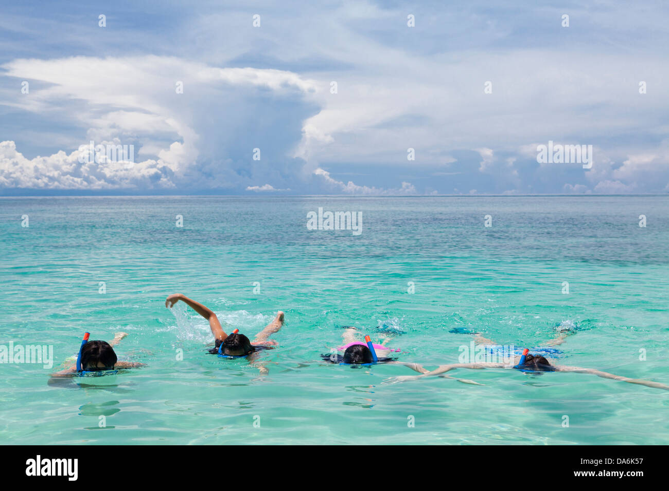 Friends snorkeling together. Stock Photo