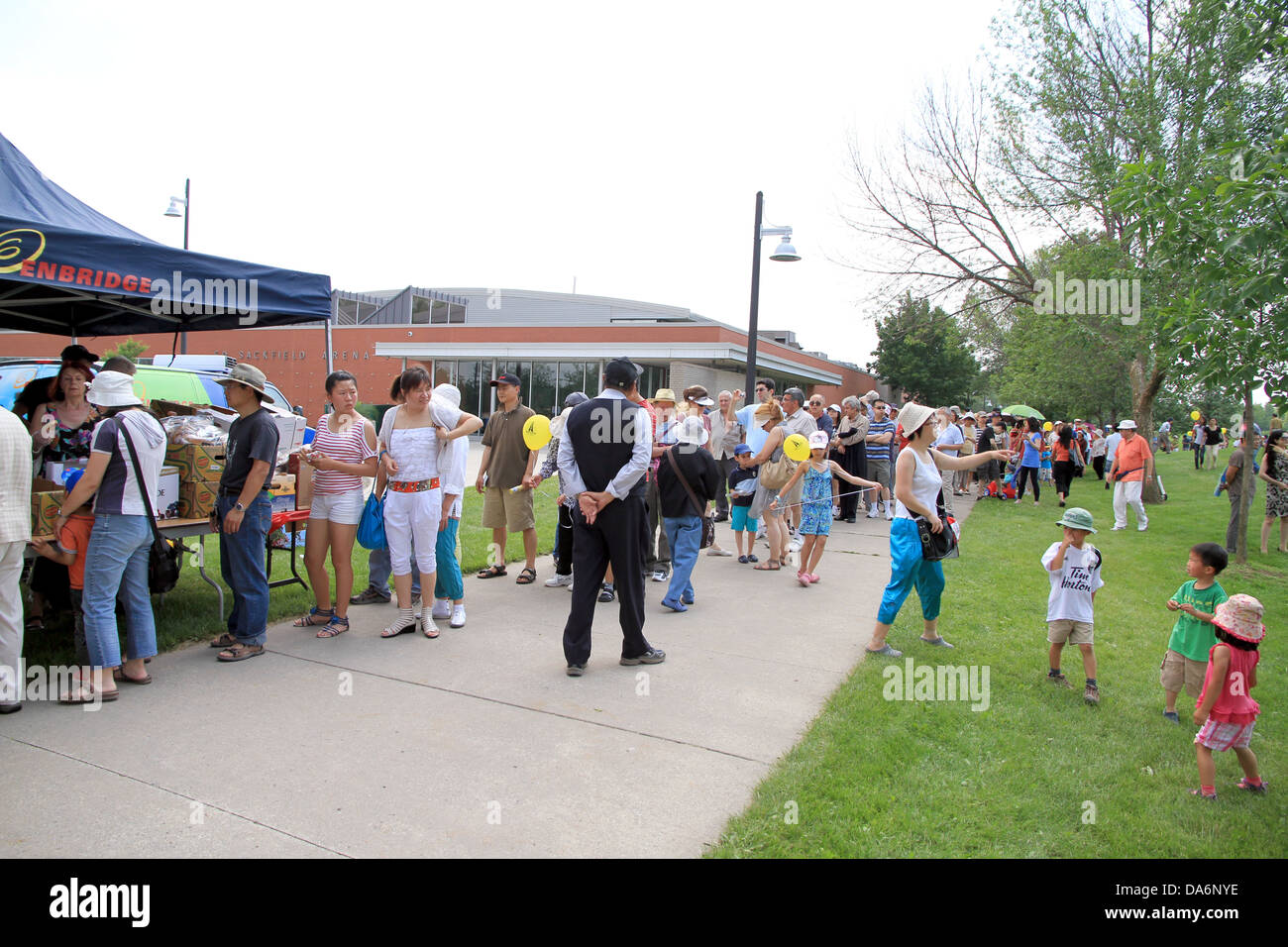 People queuing in a park on June 23, 2013 in Toronto, Canada Stock Photo