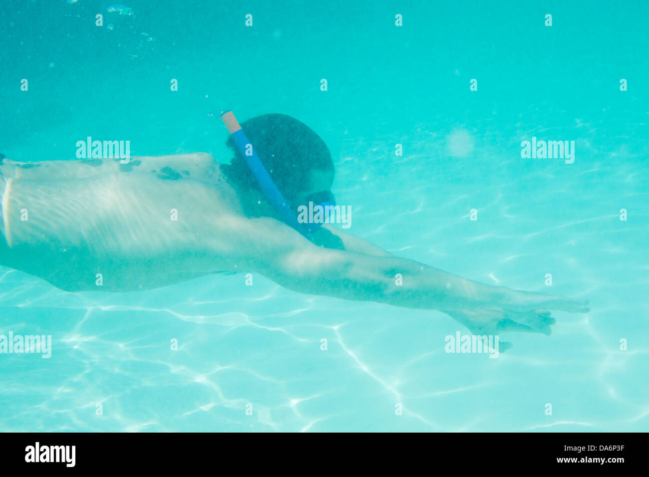 A man snorkeling underwater. Stock Photo