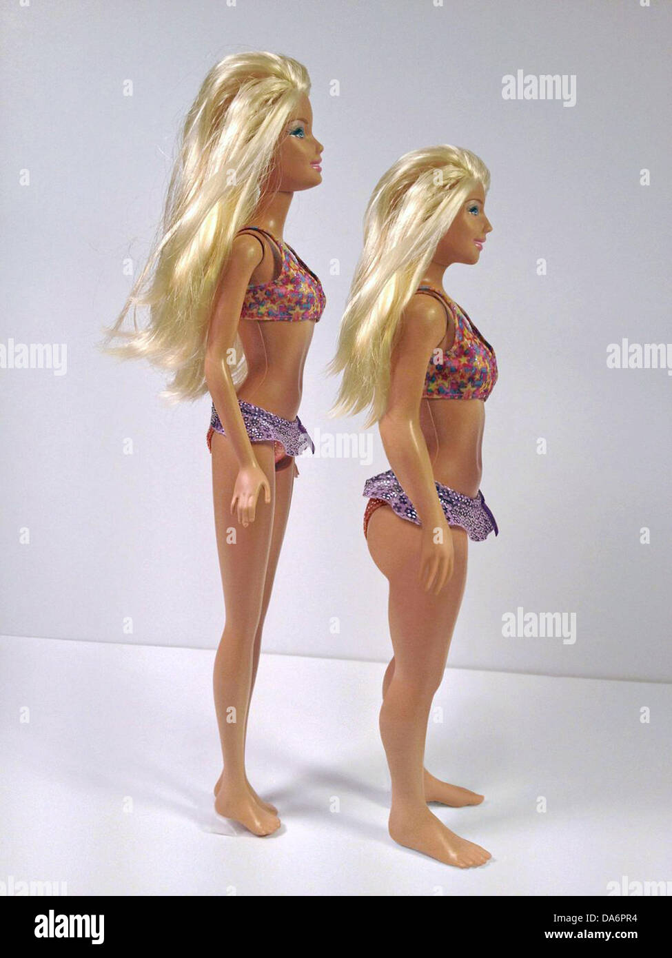 (HANDOUT) An undated handout photo shows a barbie doll (L) and a more realistic version of the toy icon by US artist Nickolay Lamm which he created proportionately to the average measures of a woman according to offical data of the American health office CDC using a 3D printer. Photo: NICKOLAY LAMM/MYDEALS.COM  ATTENTION: Use for editorial purposes and with the mention of the author only. Stock Photo