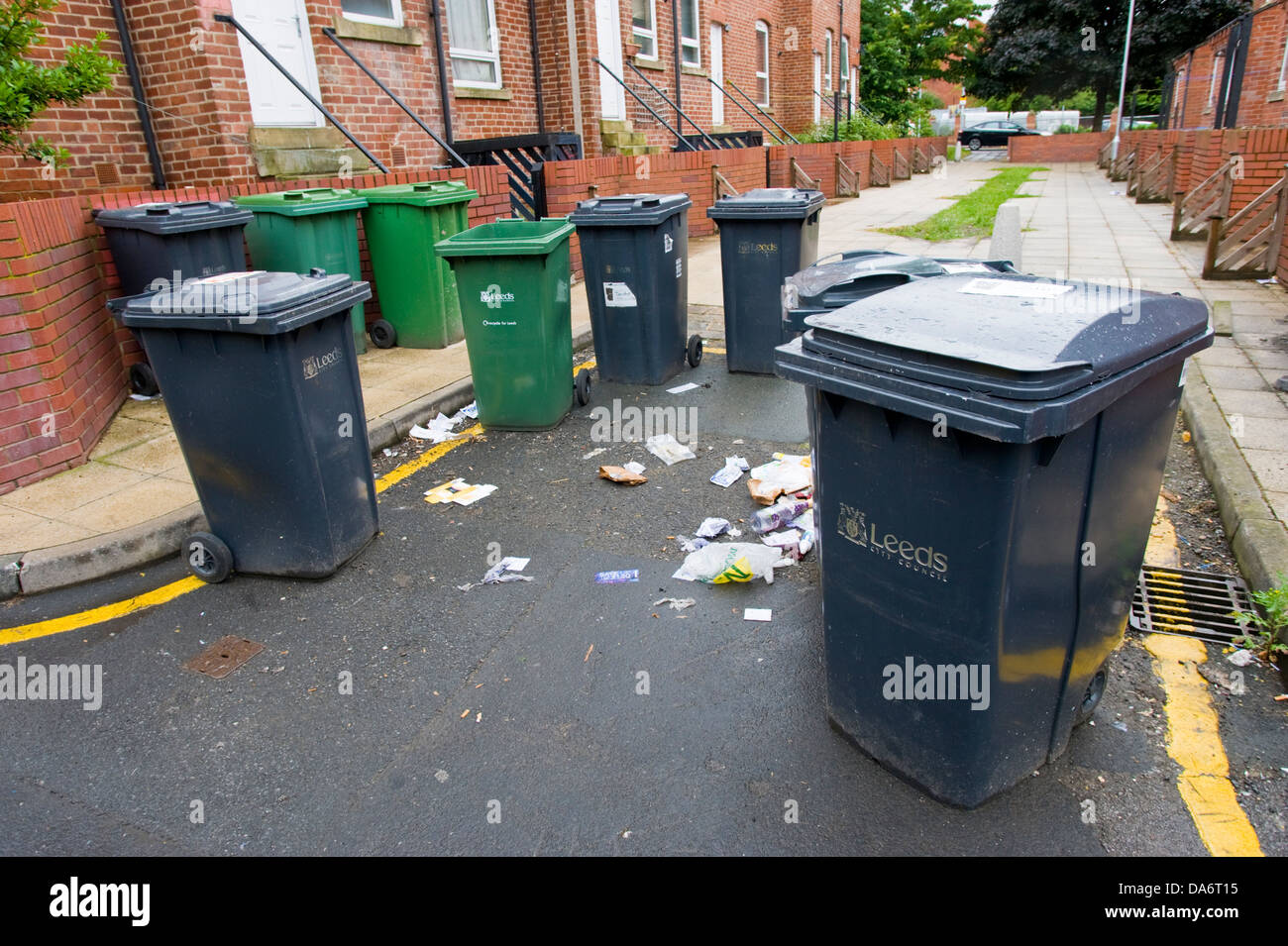 Domestic household rubbish wheelie bins on street corner in Leeds West