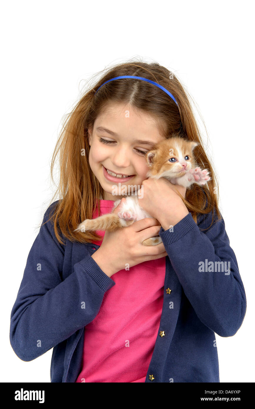 Beautiful young girl posing with a lovely young kitten Stock Photo - Alamy