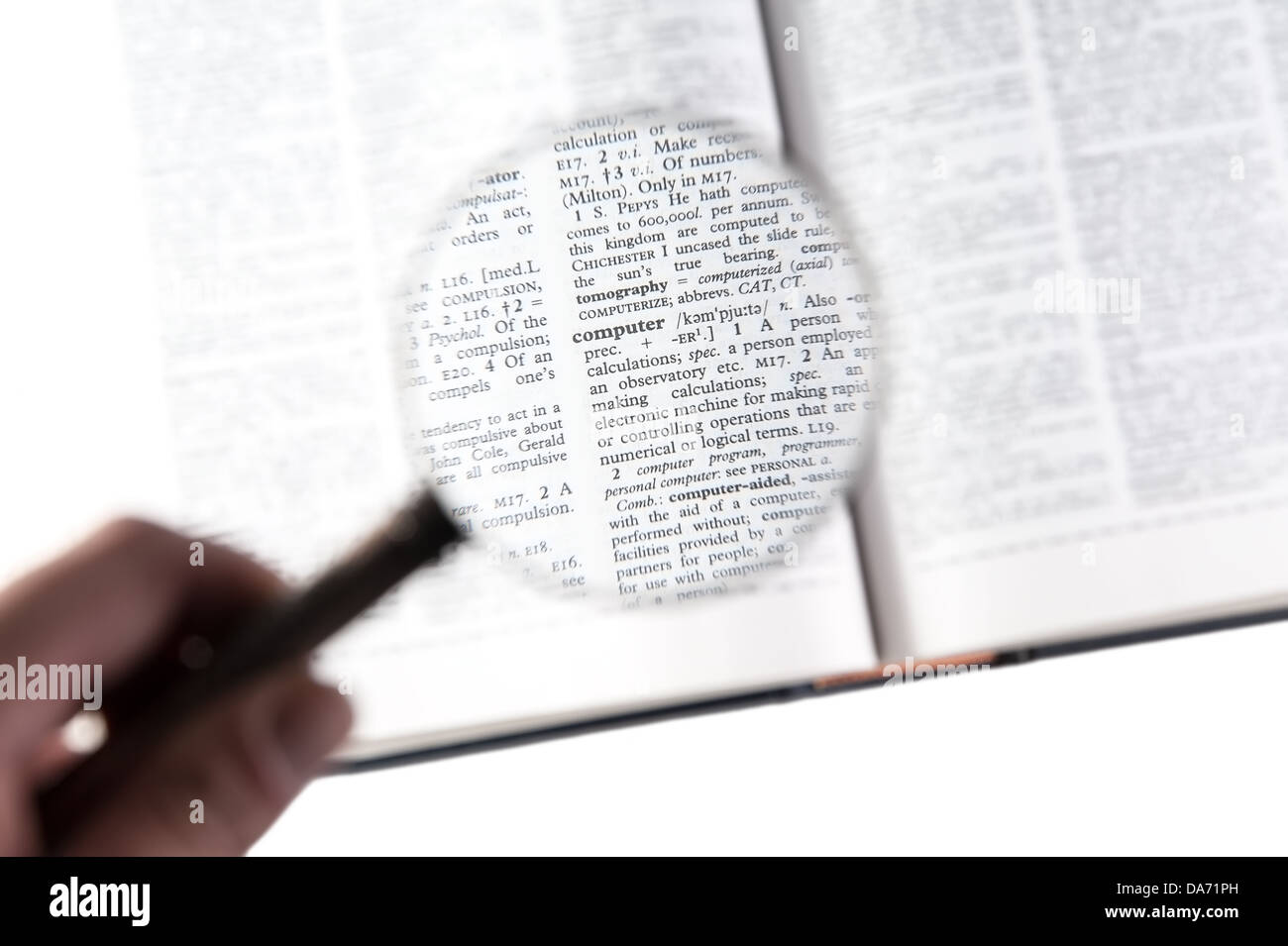 A magnifying glass on the word computer on a dictionary Stock Photo