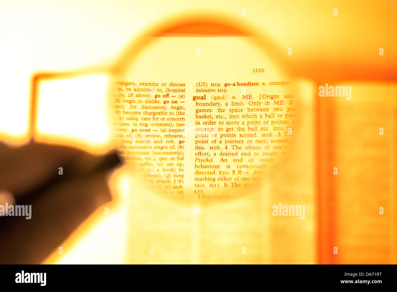 A magnifying glass on the word goal on a dictionary Stock Photo
