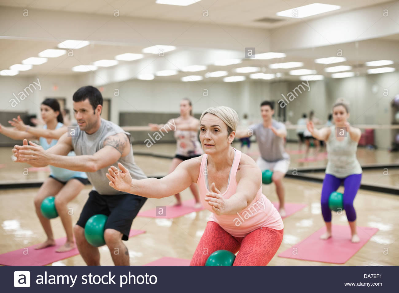 Group of people exercising in fitness class Stock Photo