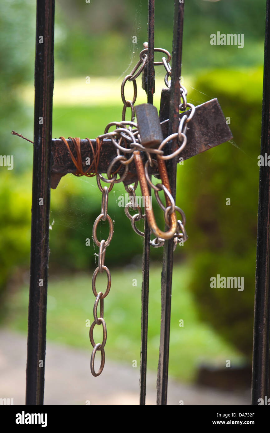 Padlock on a garden gate for security Stock Photo