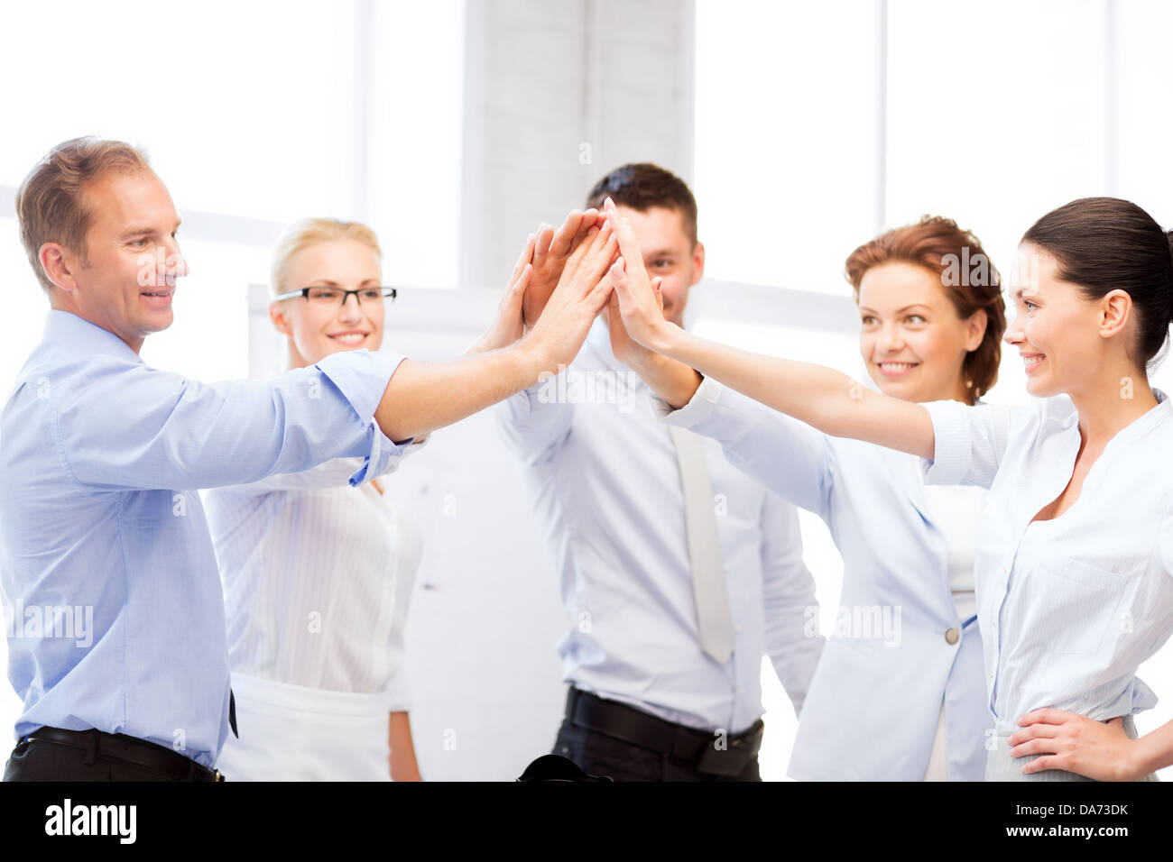 business team celebrating victory in office Stock Photo - Alamy