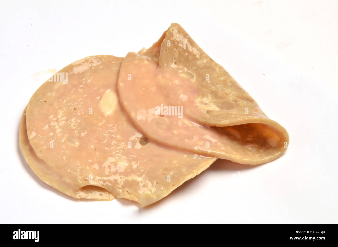 Old decomposing dried rotten ham and chicken pieces Stock Photo