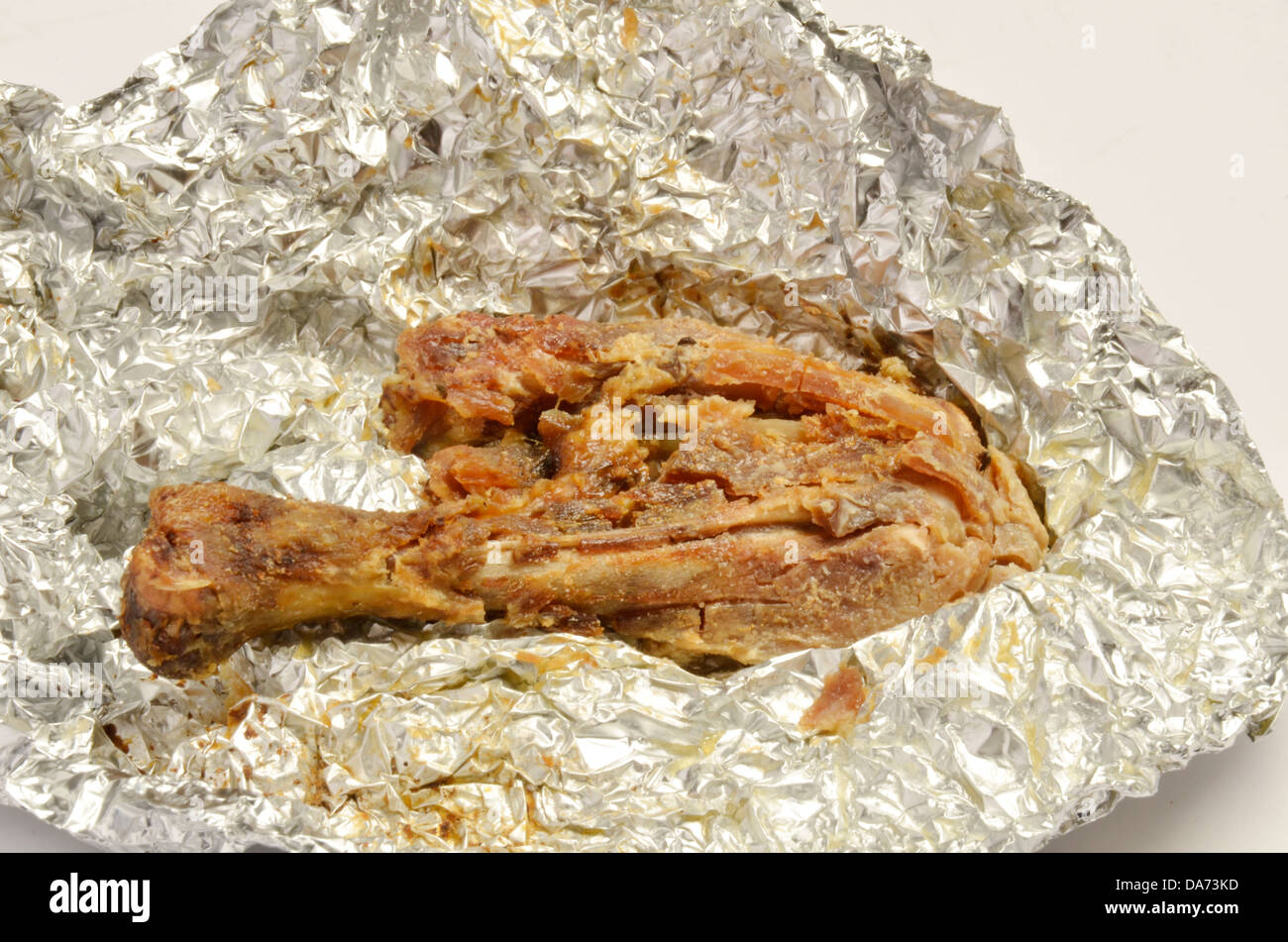 Old decomposing dried rotten and chicken piece. Stock Photo
