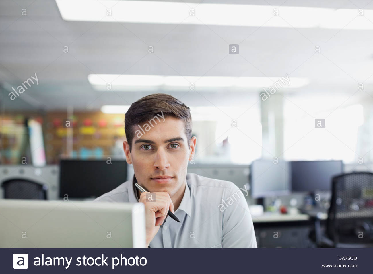 Sitting At Her Desk With Her Hand On Head Stock Photos Sitting