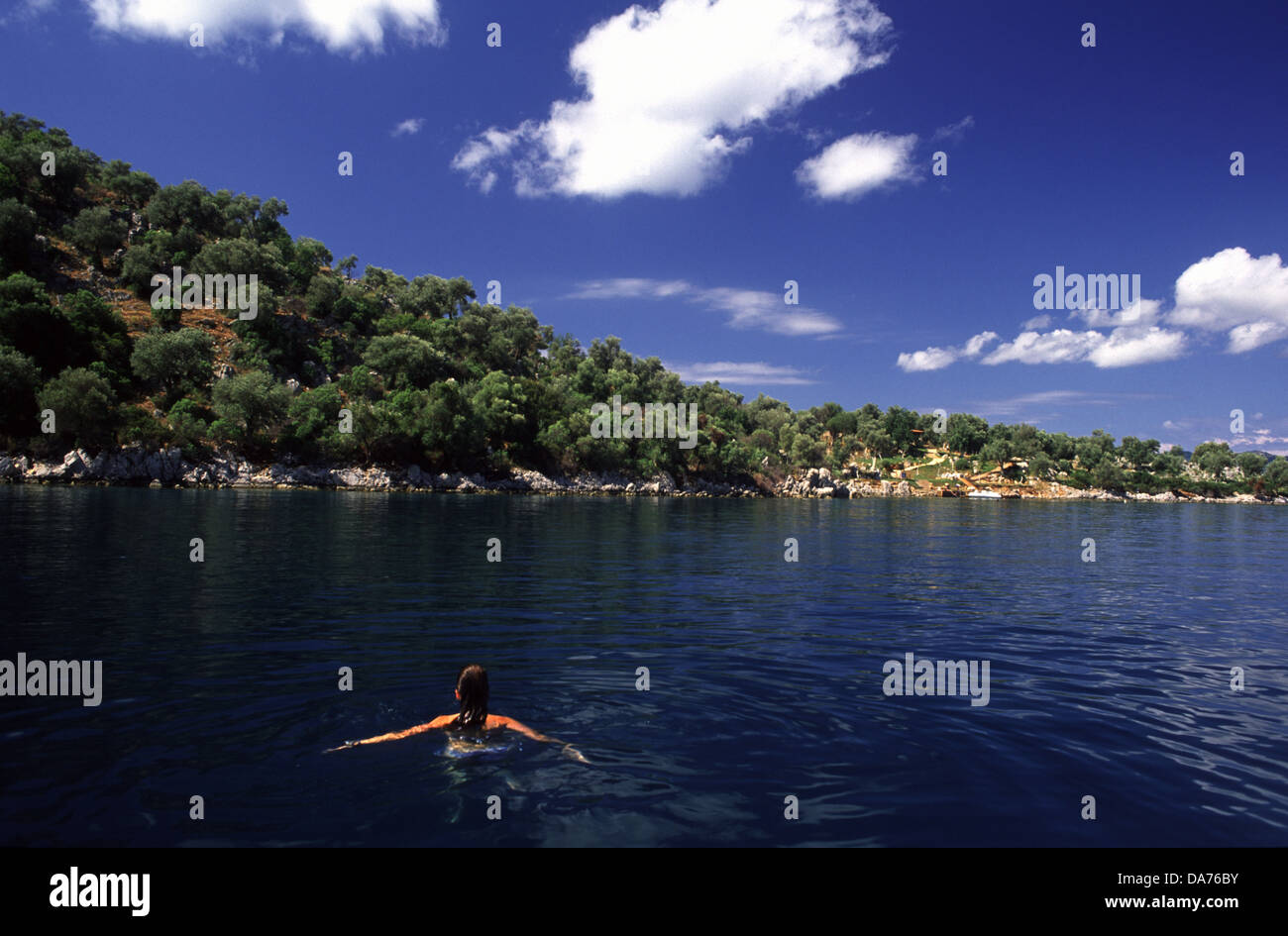 Young woman swimming along the shoreline of the Turkish Riviera near Marmaris southwest Turkey Stock Photo